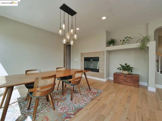 Dining room, Fireplace, Interior, Pendant Lights, Recessed Lighting, Wood Texture Flooring