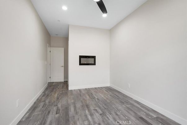 Empty room, Fireplace, Interior, Recessed Lighting, Wood Texture Flooring