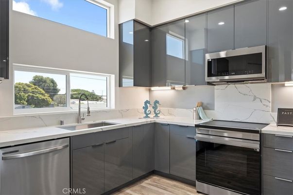 Interior, Kitchen, Marble Walls, Stainless Steel Appliances, Wood Texture Flooring