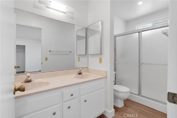 Bathroom, Dual Sink Vanities, Glass Shower, Interior, Recessed Lighting, Wood Texture Flooring
