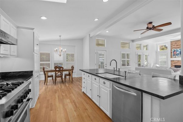 Chandelier, Dining room, Fireplace, Interior, Kitchen, Recessed Lighting, Stainless Steel Appliances, Wood Texture Flooring