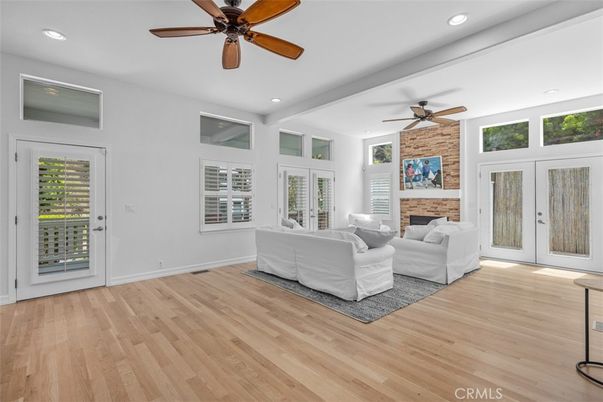 Fireplace, Interior, Living room, Recessed Lighting, Stone Walls, Wood Texture Flooring