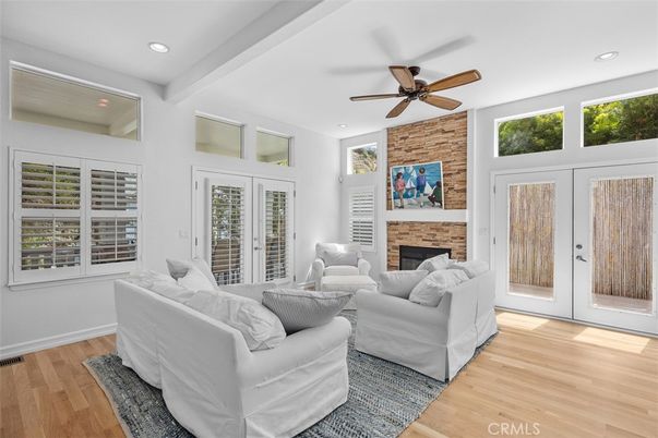 Fireplace, Interior, Living room, Recessed Lighting, Stone Walls, Wood Texture Flooring