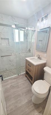 Bathroom, Glass Shower, Interior, Marble Walls, Wood Texture Flooring