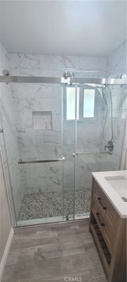 Bathroom, Glass Shower, Interior, Marble Walls, Wood Texture Flooring