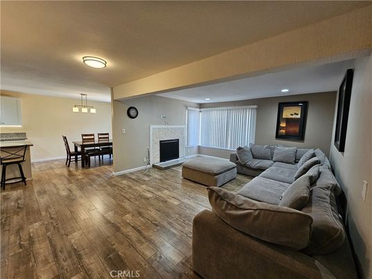 Dining room, Fireplace, Interior, Living room, Pendant Lights, Recessed Lighting, Wood Texture Flooring