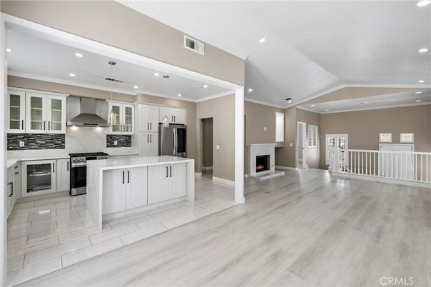 Fireplace, Interior, Kitchen, Pendant Lights, Recessed Lighting, Stainless Steel Appliances, Wood Texture Flooring