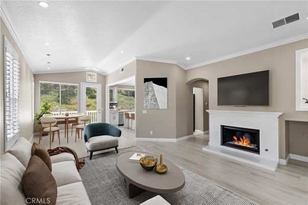 Dining room, Fireplace, Interior, Living room, Recessed Lighting, Wood Texture Flooring
