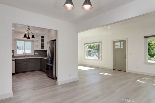 Empty room, Interior, Kitchen, Pendant Lights, Recessed Lighting, Stainless Steel Appliances, Wood Texture Flooring