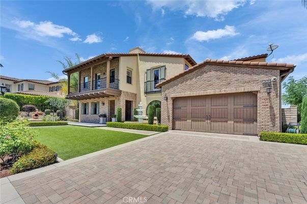 Attached, Backyard, Exterior, Facade, Brick Facade, Mediterranean
