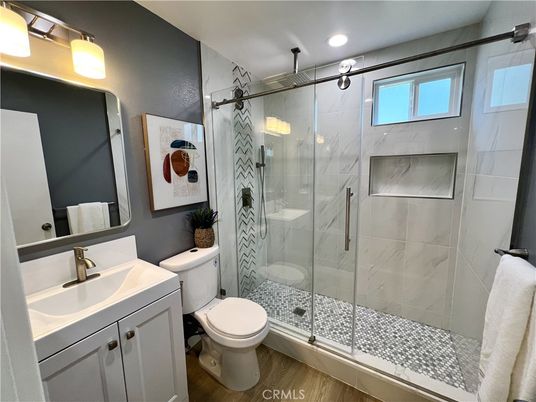 Bathroom, Glass Shower, Interior, Marble Walls, Recessed Lighting, Wood Texture Flooring