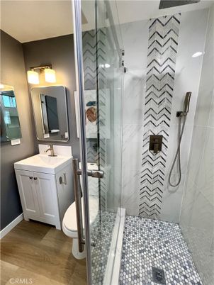 Bathroom, Glass Shower, Interior, Marble Walls, Wood Texture Flooring