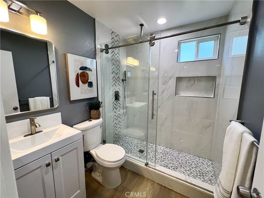 Bathroom, Glass Shower, Interior, Marble Walls, Recessed Lighting, Wood Texture Flooring