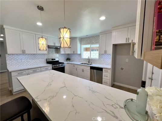 Interior, Kitchen, Pendant Lights, Recessed Lighting, Stainless Steel Appliances, Wood Texture Flooring