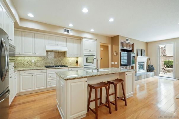 Fireplace, Interior, Kitchen, Recessed Lighting, Stainless Steel Appliances, Wood Texture Flooring