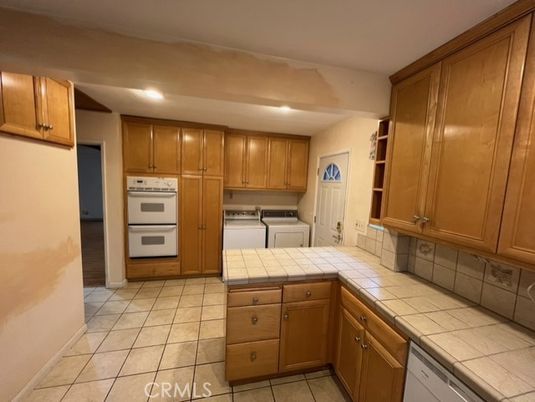 Interior, Kitchen, Recessed Lighting, Tile Countertops, Washer