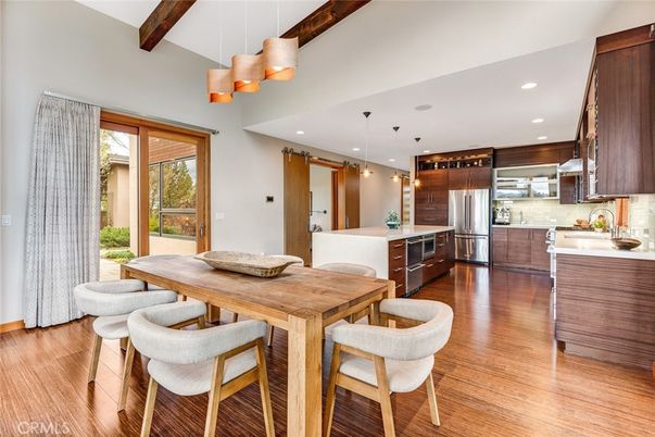 Dining room, Interior, Kitchen, Pendant Lights, Recessed Lighting, Stainless Steel Appliances, Wood Texture Flooring
