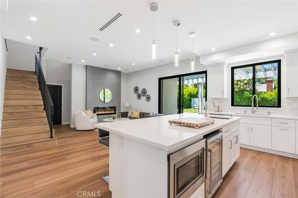 Fireplace, Interior, Kitchen, Living room, Pendant Lights, Recessed Lighting, Stainless Steel Appliances, Wood Texture Flooring