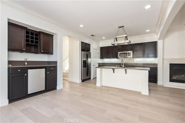 Fireplace, Interior, Kitchen, Pendant Lights, Recessed Lighting, Stainless Steel Appliances, Wood Texture Flooring