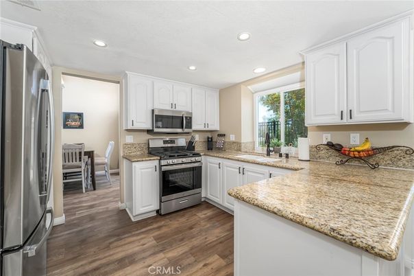 Dining room, Interior, Kitchen, Recessed Lighting, Stainless Steel Appliances, Wood Texture Flooring