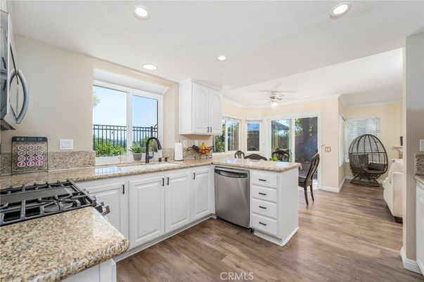 Dining room, Interior, Kitchen, Recessed Lighting, Stainless Steel Appliances, Wood Texture Flooring