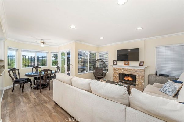 Dining room, Fireplace, Interior, Living room, Recessed Lighting, Wood Texture Flooring