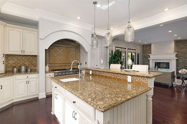 Fireplace, Interior, Kitchen, Pendant Lights, Recessed Lighting, Stainless Steel Appliances, Stone Walls, Wood Texture Flooring