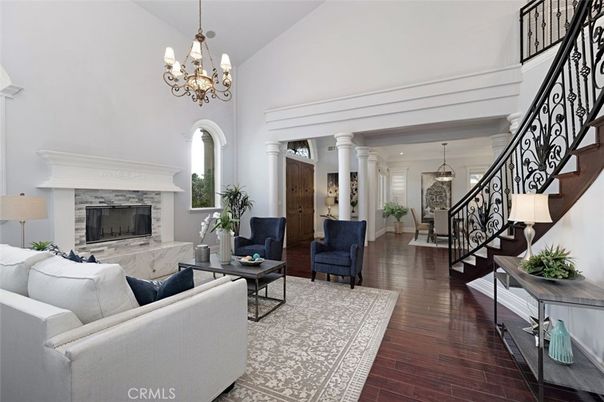 Chandelier, Fireplace, Interior, Living room, Pendant Lights, Recessed Lighting, Wood Texture Flooring