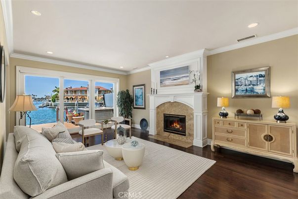 Fireplace, Interior, Living room, Recessed Lighting, Water, Wood Texture Flooring
