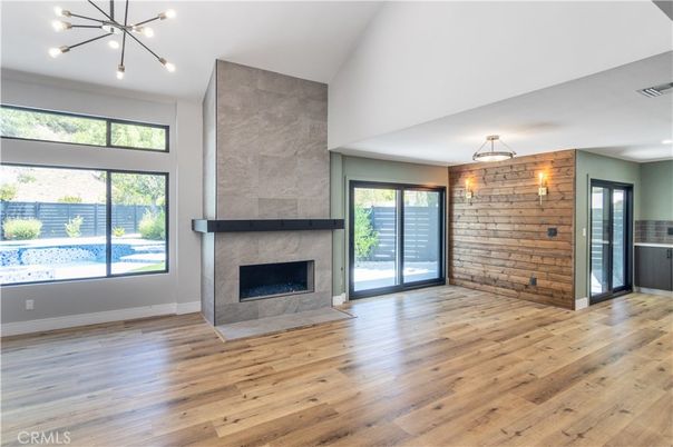 Empty room, Fireplace, Interior, Pendant Lights, Stone Walls, Wood Texture Flooring
