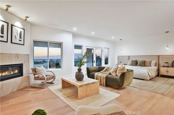 Bedroom, Fireplace, Interior, Living room, Pendant Lights, Recessed Lighting, Water, Wood Texture Flooring