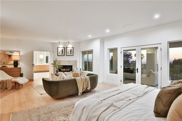 Bedroom, Fireplace, Interior, Pendant Lights, Recessed Lighting, Wood Texture Flooring