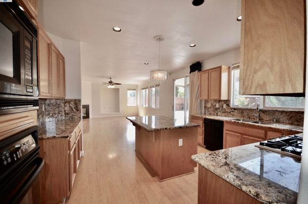 Chandelier, Interior, Kitchen, Pendant Lights, Recessed Lighting, Stainless Steel Appliances, Wood Texture Flooring