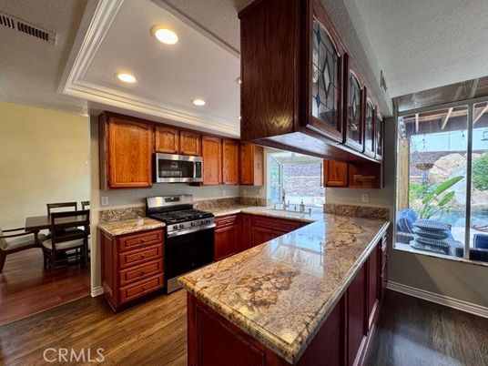 Dining room, Interior, Kitchen, Recessed Lighting, Stainless Steel Appliances, Wood Texture Flooring