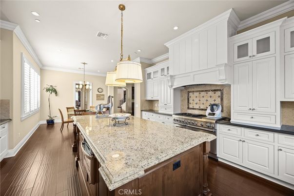 Chandelier, Dining room, Interior, Kitchen, Pendant Lights, Recessed Lighting, Stainless Steel Appliances, Wood Texture Flooring