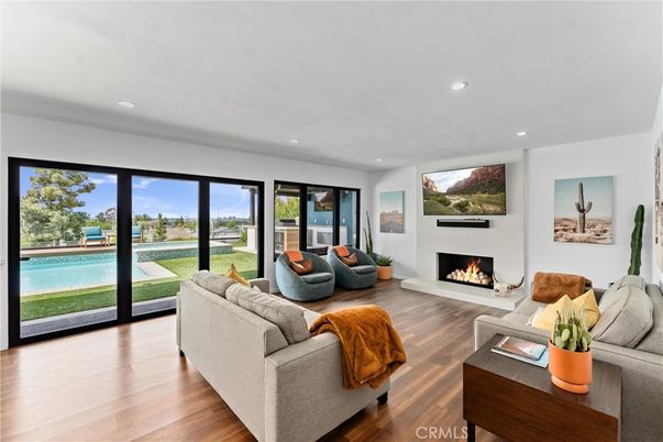 Fireplace, Interior, Living room, Recessed Lighting, Water, Wood Texture Flooring