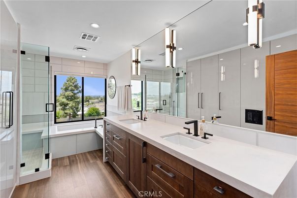Bathroom, Dual Sink Vanities, Glass Shower, Interior, Recessed Lighting, Wood Texture Flooring