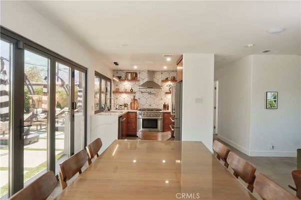 Dining room, Fireplace, Interior, Kitchen, Marble Walls, Recessed Lighting, Stainless Steel Appliances