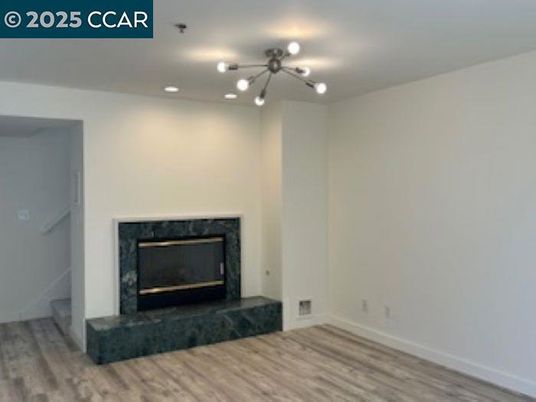 Empty room, Fireplace, Interior, Pendant Lights, Recessed Lighting, Wood Texture Flooring
