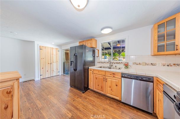 Interior, Kitchen, Recessed Lighting, Stainless Steel Appliances, Tile Countertops, Wood Texture Flooring