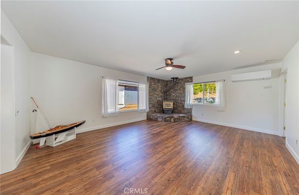 Empty room, Fireplace, Interior, Recessed Lighting, Stone Walls, Wood Texture Flooring