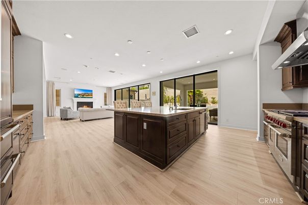 Fireplace, Interior, Kitchen, Recessed Lighting, Stainless Steel Appliances, Wood Texture Flooring