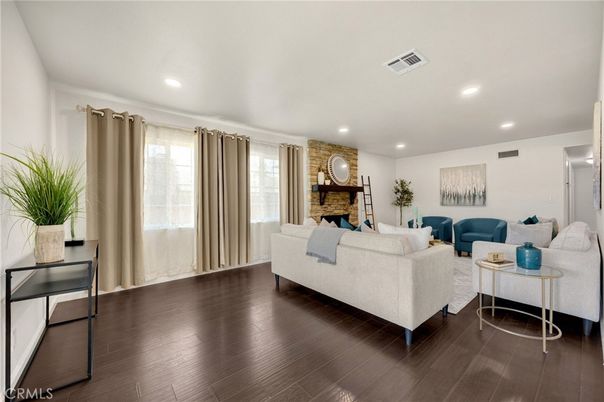 Fireplace, Interior, Living room, Recessed Lighting, Stone Walls, Wood Texture Flooring