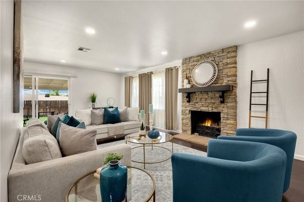 Fireplace, Interior, Living room, Recessed Lighting, Stone Walls, Wood Texture Flooring