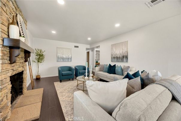 Fireplace, Interior, Living room, Recessed Lighting, Stone Walls, Wood Texture Flooring