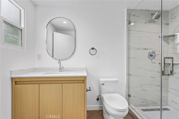 Bathroom, Glass Shower, Interior, Marble Walls, Recessed Lighting, Wood Texture Flooring