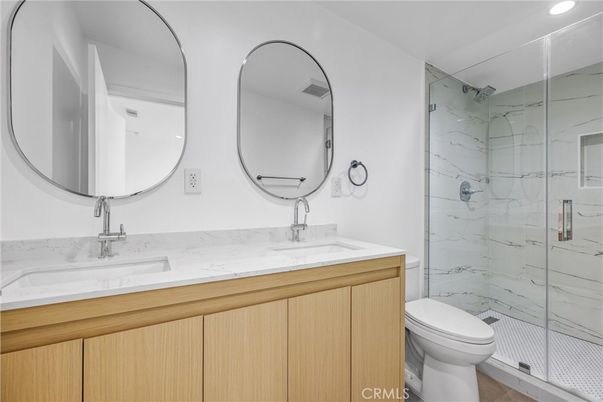 Bathroom, Dual Sink Vanities, Glass Shower, Interior, Marble Walls, Recessed Lighting