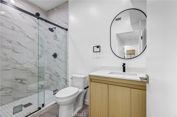 Bathroom, Glass Shower, Interior, Marble Walls, Recessed Lighting, Wood Texture Flooring