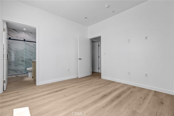 Bathroom, Empty room, Glass Shower, Interior, Marble, Marble Walls, Recessed Lighting, Wood Texture Flooring