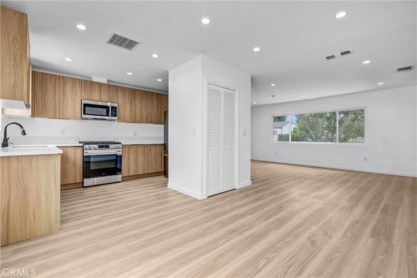 Interior, Kitchen, Recessed Lighting, Stainless Steel Appliances, Wood Texture Flooring